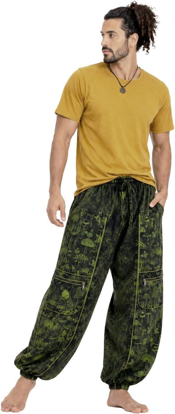 Man wearing the mushroom print harem pants with a yellow T-shirt