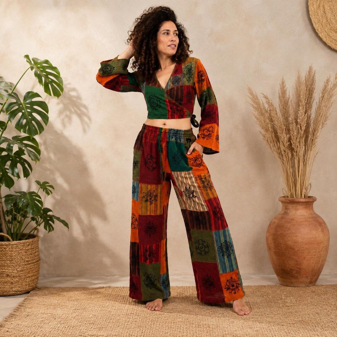 Woman wearing the patchwork palazzo pants and bell-sleeve wrap top